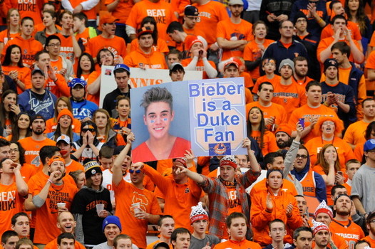 SYRACUSE, NY - FEBRUARY 01:  A Syracuse Orange fans hold up sign of Justin Bieber (not pictured) during ESPN College GameDay prior to the game between the Duke Blue Devils and the Syracuse Orange at the Carrier Dome on February 1, 2014 in Syracuse, New York.  (Photo by Rich Barnes/Getty Images)